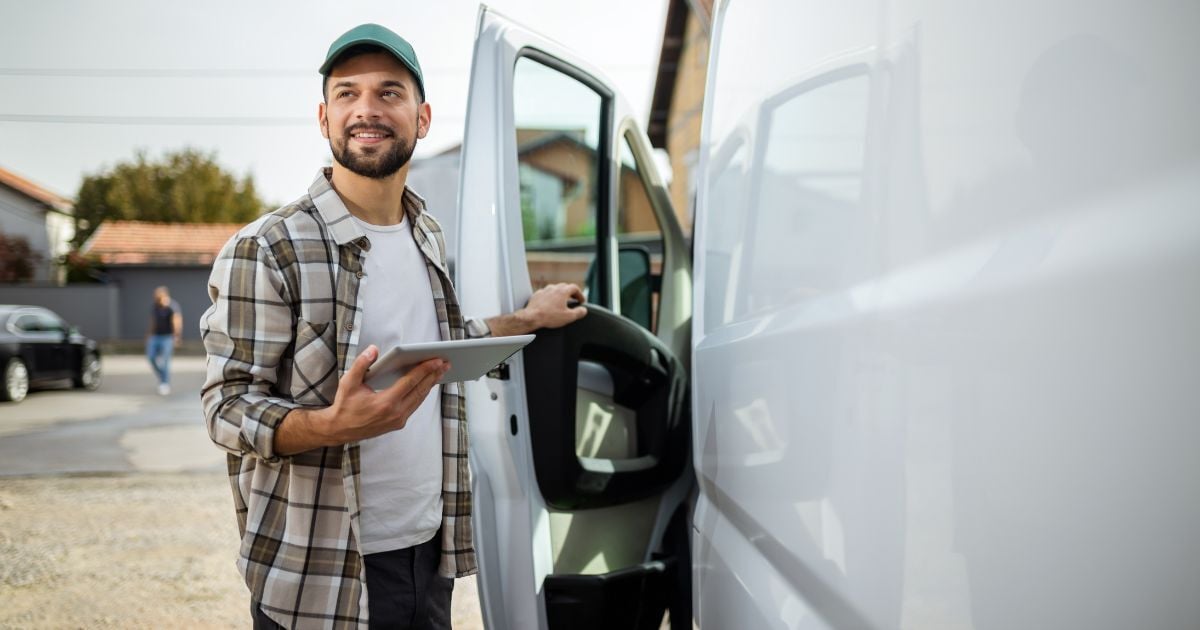 Photo of a small business owner getting into a commercial van